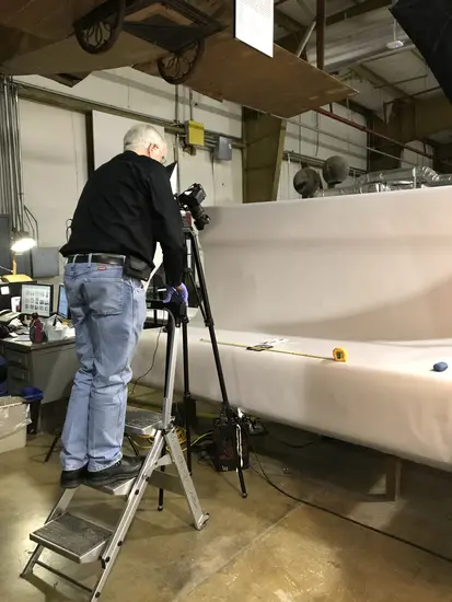 Volunteer Jim Walker takes a high-resolution photograph of a Langley artifact.