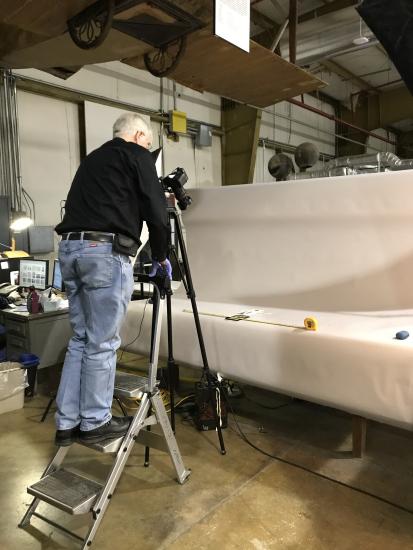 Volunteer Jim Walker takes a high-resolution photograph of a Langley artifact.