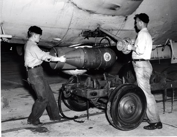 Two crewmen load K-ship