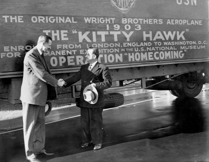 Two men in front of aircraft