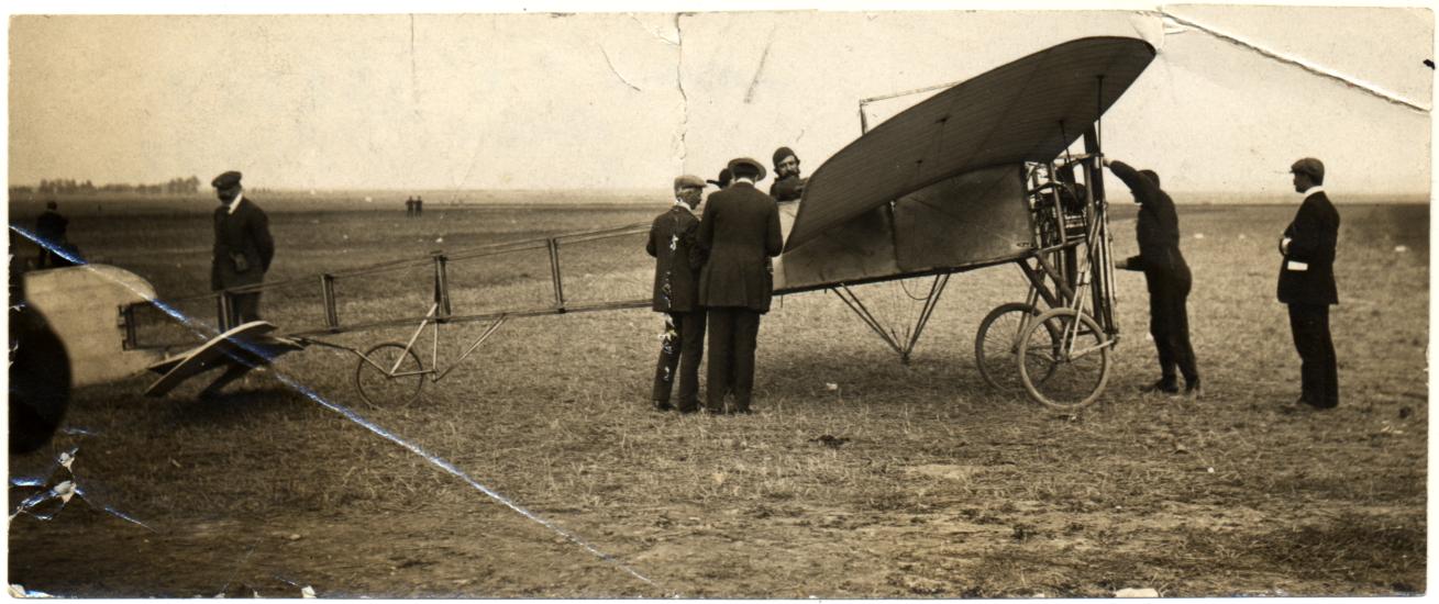 Men gathered around aircraft