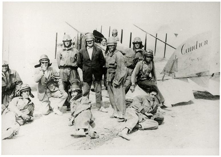 Group of students in front of an airplane