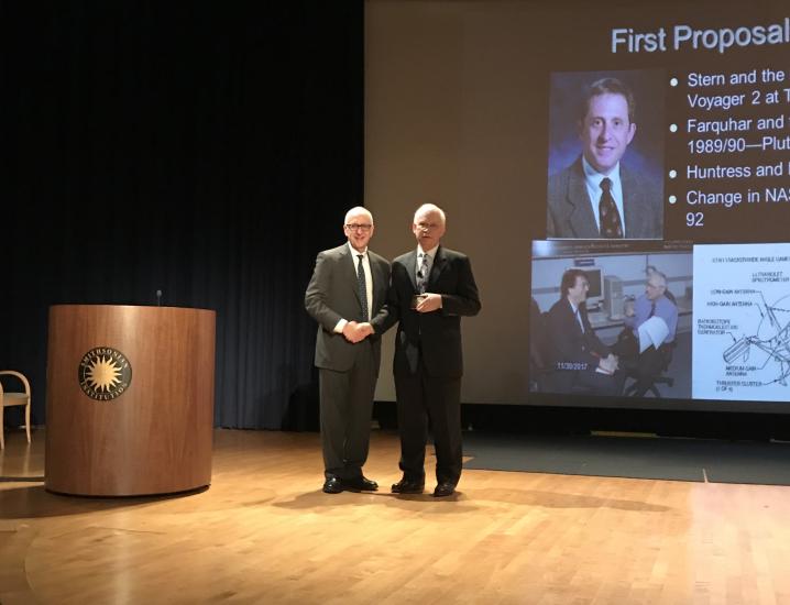  David Skorton and Michael Neufeld pose on stage.