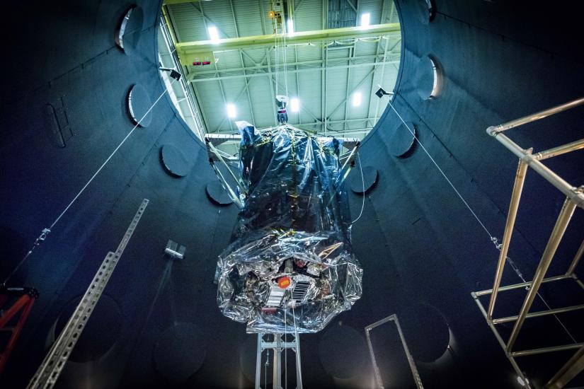 The Parker Solar Probe being lifted out of a vacuum testing chamber 