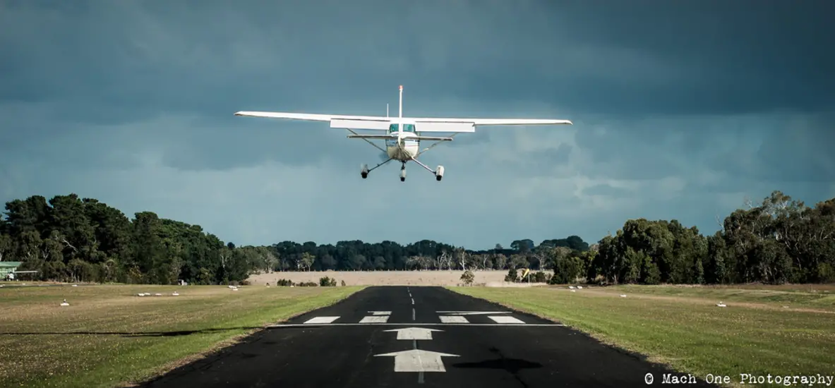 A small aircraft taking off from a runway