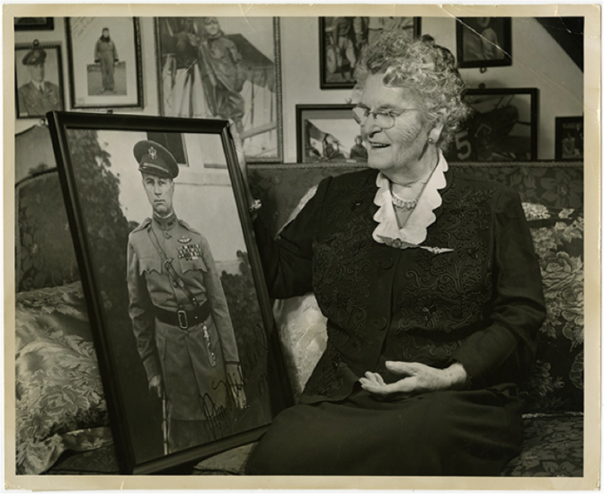 Mother Tusch sitting on a couch at her home