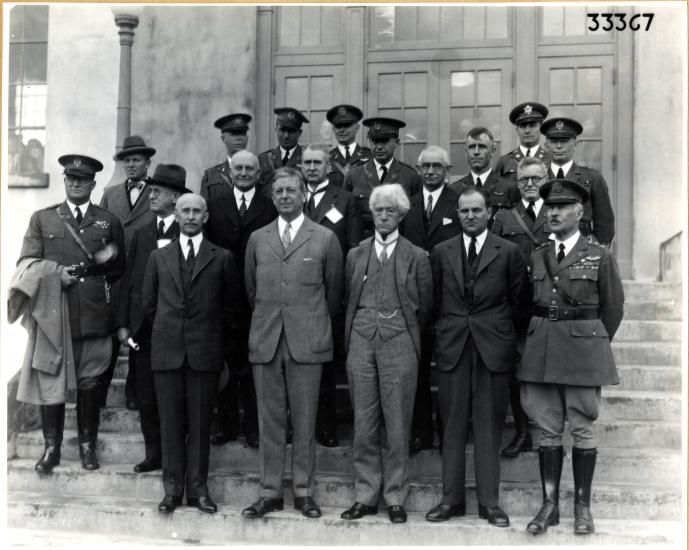 Group of men on stairs in front of a building