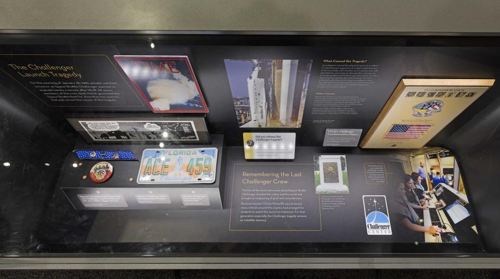 A display case in the Moving Beyond Earth exhibition, commemorating the Challenger launch tragedy.