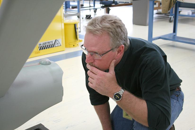  ILM model maker John Goodson studies the hangar deck at the back of the ship’s engineering hull. 