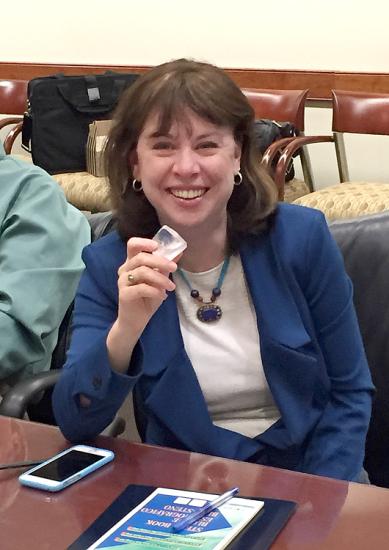 Dr. Margaret Weitekamp holding a dilithium crystal